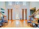 Bright foyer with high ceilings, stained glass, and a charming chandelier at 1135 Candler Rd, Clearwater, FL 33765