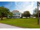 Two story home with wrap around porch and large yard at 1135 Candler Rd, Clearwater, FL 33765