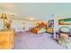 Large main bedroom with high ceilings, ornate furniture, and walk-in closet access at 1135 Candler Rd, Clearwater, FL 33765