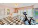 Exercise room with Peloton bike, bar area, and French doors at 1135 Candler Rd, Clearwater, FL 33765