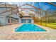 Spacious pool and patio area with screened enclosure at 1135 Candler Rd, Clearwater, FL 33765