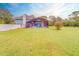 Screened-in pool and patio area in the backyard at 1135 Candler Rd, Clearwater, FL 33765