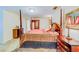 Bedroom with four-poster bed and ample space at 1135 Candler Rd, Clearwater, FL 33765