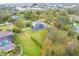 Aerial view of house with pool and large lot at 1135 Candler Rd, Clearwater, FL 33765