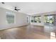 Bright living room with modern floors, ample natural light, and sliding glass doors to the outdoor space at 11606 Tropical Isle Ln, Riverview, FL 33579