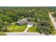 Aerial view of the estate showcasing the expansive lot, pool, and lush landscaping at 2501 Rustic Oaks Dr, Lutz, FL 33559