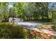 Enjoy a private basketball court with ample space for games and recreation, surrounded by lush greenery at 2501 Rustic Oaks Dr, Lutz, FL 33559