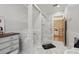 Spacious bathroom featuring glass shower, neutral paint, and hexagon tile floors at 2501 Rustic Oaks Dr, Lutz, FL 33559