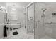 Bathroom boasts glass shower, standalone tub, hexagon tile floors, and bright light fixture at 2501 Rustic Oaks Dr, Lutz, FL 33559