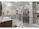 Bright bathroom features a standalone tub, dual vanities, and a walk-in shower at 2501 Rustic Oaks Dr, Lutz, FL 33559