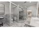 Gorgeous bathroom with a walk-in shower, marble tiling, and and sink at 2501 Rustic Oaks Dr, Lutz, FL 33559