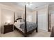 This bedroom boasts neutral paint, carpet floors, and a decorative four-poster bed at 2501 Rustic Oaks Dr, Lutz, FL 33559