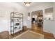 Open concept entryway features hardwood floors, a jute rug, and an open concept at 2501 Rustic Oaks Dr, Lutz, FL 33559