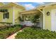Quaint front porch with mature landscaping for enhanced privacy and curb appeal at 2501 Rustic Oaks Dr, Lutz, FL 33559
