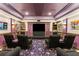 Comfortable home theater with tiered seating, movie-themed decor, perfect for immersive viewing at 2501 Rustic Oaks Dr, Lutz, FL 33559