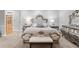 A large bed is the focal point of this main bedroom with luxury furniture at 2501 Rustic Oaks Dr, Lutz, FL 33559