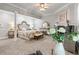 Spacious main bedroom with a fireplace, sitting area, and stylish decor at 2501 Rustic Oaks Dr, Lutz, FL 33559
