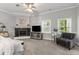 Main bedroom features a fireplace, windows, and a ceiling fan at 2501 Rustic Oaks Dr, Lutz, FL 33559
