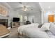 Main bedroom includes a fireplace, sitting area, and view of the room at 2501 Rustic Oaks Dr, Lutz, FL 33559
