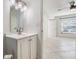Clean bathroom with white vanity and updated lighting at 3020 Bonaventure Cir # 102, Palm Harbor, FL 34684