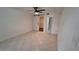 Bedroom with barn door to closet and en-suite bath at 3020 Bonaventure Cir # 102, Palm Harbor, FL 34684