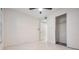 Spacious bedroom featuring a large closet and ceiling fan at 3020 Bonaventure Cir # 102, Palm Harbor, FL 34684