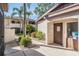 Building exterior showing pathway and lush landscaping at 3020 Bonaventure Cir # 102, Palm Harbor, FL 34684