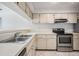 Bright kitchen features stainless steel appliances and ample cabinetry at 3020 Bonaventure Cir # 102, Palm Harbor, FL 34684