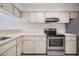 Efficient kitchen with ample cabinet space and stovetop at 3020 Bonaventure Cir # 102, Palm Harbor, FL 34684