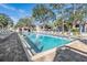 Inviting community pool with plenty of lounge chairs at 3020 Bonaventure Cir # 102, Palm Harbor, FL 34684
