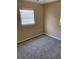 Bright bedroom with neutral walls, carpet flooring, and window blinds at 3402 W Obispo St, Tampa, FL 33629