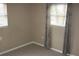 Spacious bedroom with neutral decor and window coverings at 3402 W Obispo St, Tampa, FL 33629
