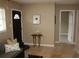 Bright entryway with tile flooring, seating area, and view to hallway at 3402 W Obispo St, Tampa, FL 33629