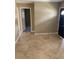 Bright entryway with tile flooring and doors leading to other rooms at 3402 W Obispo St, Tampa, FL 33629