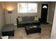 Living room with sofa, coffee table, and floor lamp at 3402 W Obispo St, Tampa, FL 33629