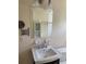 Bathroom with white sink, vanity, and large mirror at 3402 W Obispo St, Tampa, FL 33629