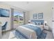 Blue-themed bedroom with window view and workspace at 37127 Goffaux Loop, Zephyrhills, FL 33541