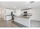 Kitchen with white shaker cabinets, granite countertops, and stainless steel appliances at 37127 Goffaux Loop, Zephyrhills, FL 33541