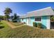 Light teal exterior of a charming house at 4223 Terrapin Pl, New Port Richey, FL 34652