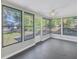 Sunroom featuring a ceiling fan and multiple windows at 4223 Terrapin Pl, New Port Richey, FL 34652