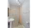 Bathroom with pedestal sink and walk-in shower at 4620 Violet Ave, Sarasota, FL 34233