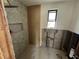 Modern bathroom with herringbone tile and a walk-in shower at 507 79Th Ave, St Pete Beach, FL 33706