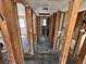 A hallway under construction with exposed framing and wiring at 507 79Th Ave, St Pete Beach, FL 33706
