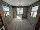 Unfinished living room with exposed cinderblock walls and flooring at 507 79Th Ave, St Pete Beach, FL 33706