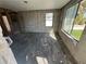 A largely empty living room with exposed cinderblock walls and flooring at 507 79Th Ave, St Pete Beach, FL 33706