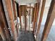 Unfinished bathroom with exposed plumbing and framing at 507 79Th Ave, St Pete Beach, FL 33706