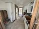 Renovation in progress: A galley kitchen with white cabinets and new flooring at 507 79Th Ave, St Pete Beach, FL 33706