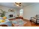 Living Room with hardwood floors, fireplace, and ceiling fan at 508 Park Blvd, Oldsmar, FL 34677