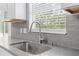 Modern kitchen sink and faucet with gray countertop at 6489 Hazelwood Rd, Spring Hill, FL 34608