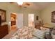 Main bedroom with ensuite bathroom and view of the kitchen at 9454 Rolling Cir, San Antonio, FL 33576